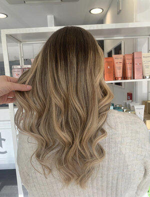 warm balayage curly hair