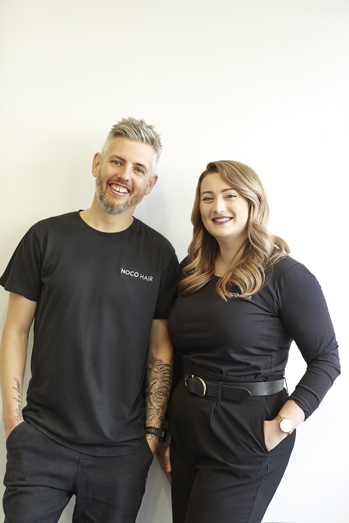 Two team members posing for staff photo