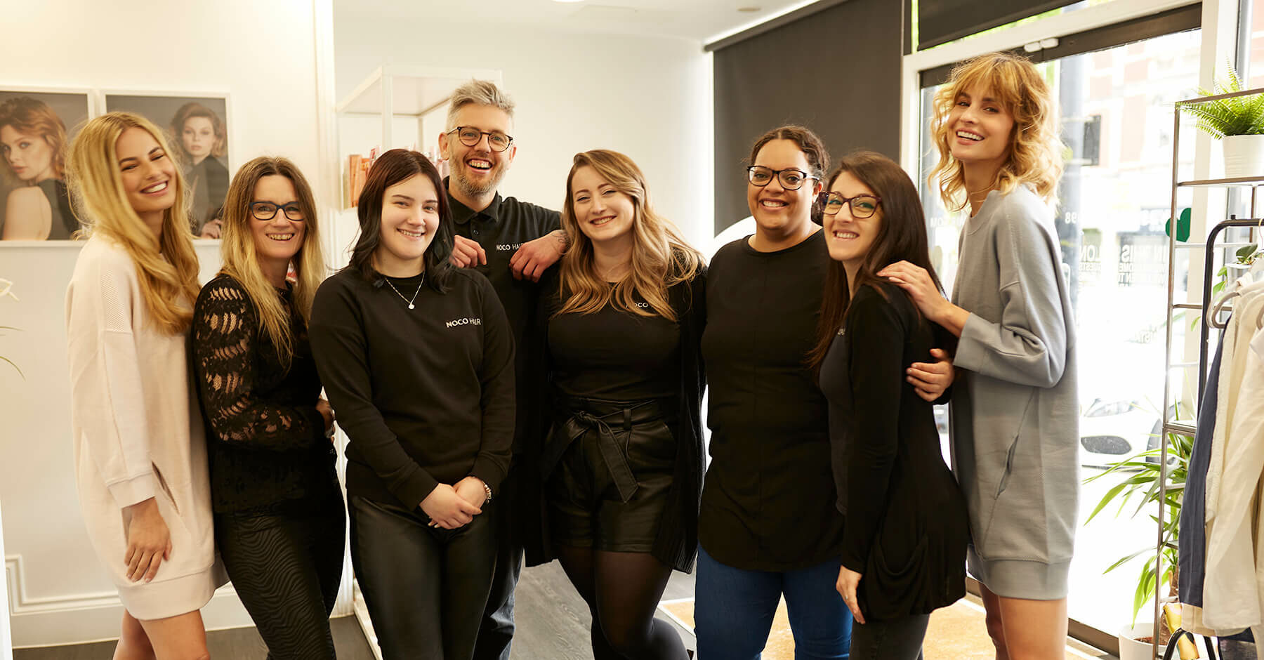 Colleagues smiling for a team photo