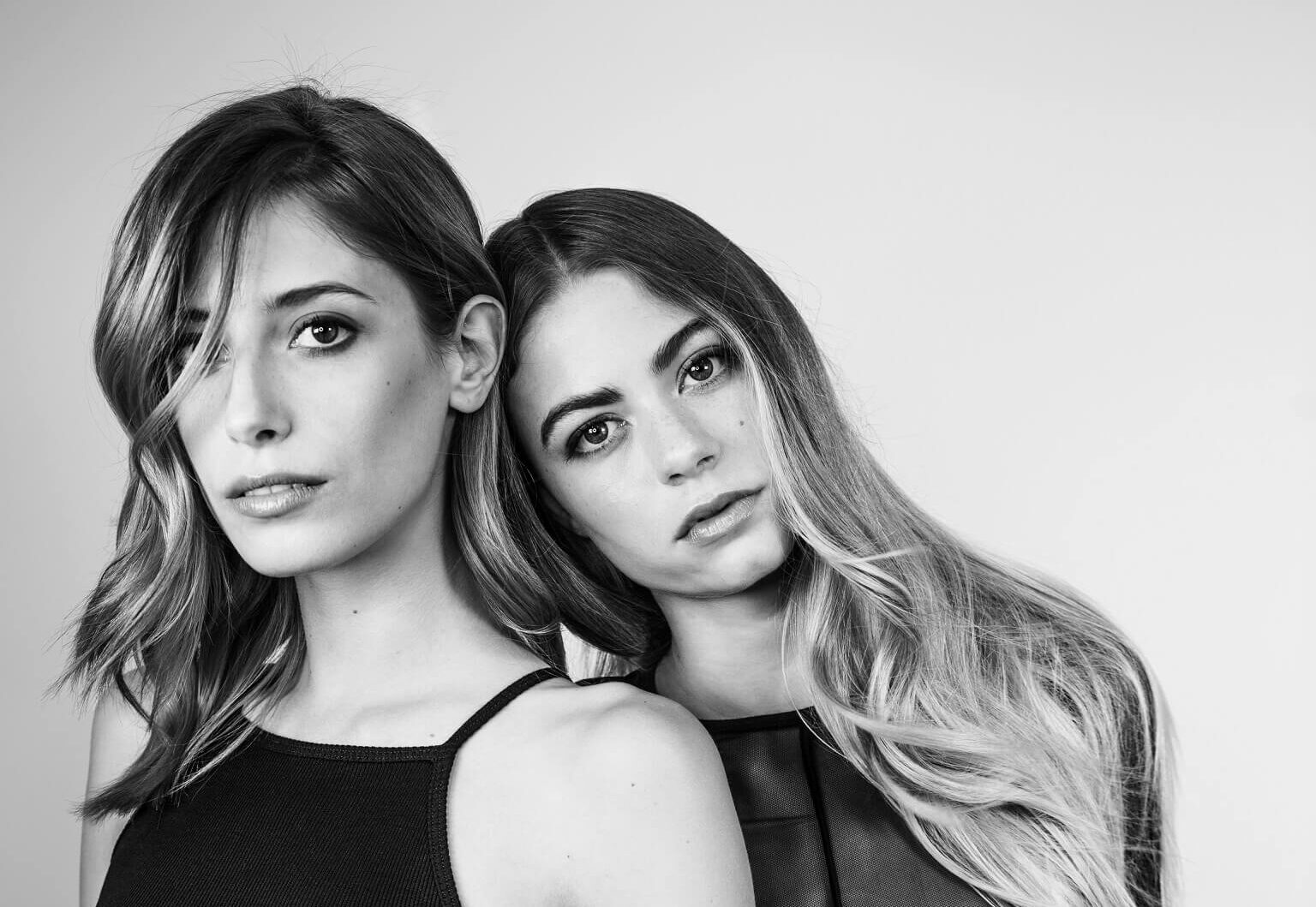 Two women posing with finished hair