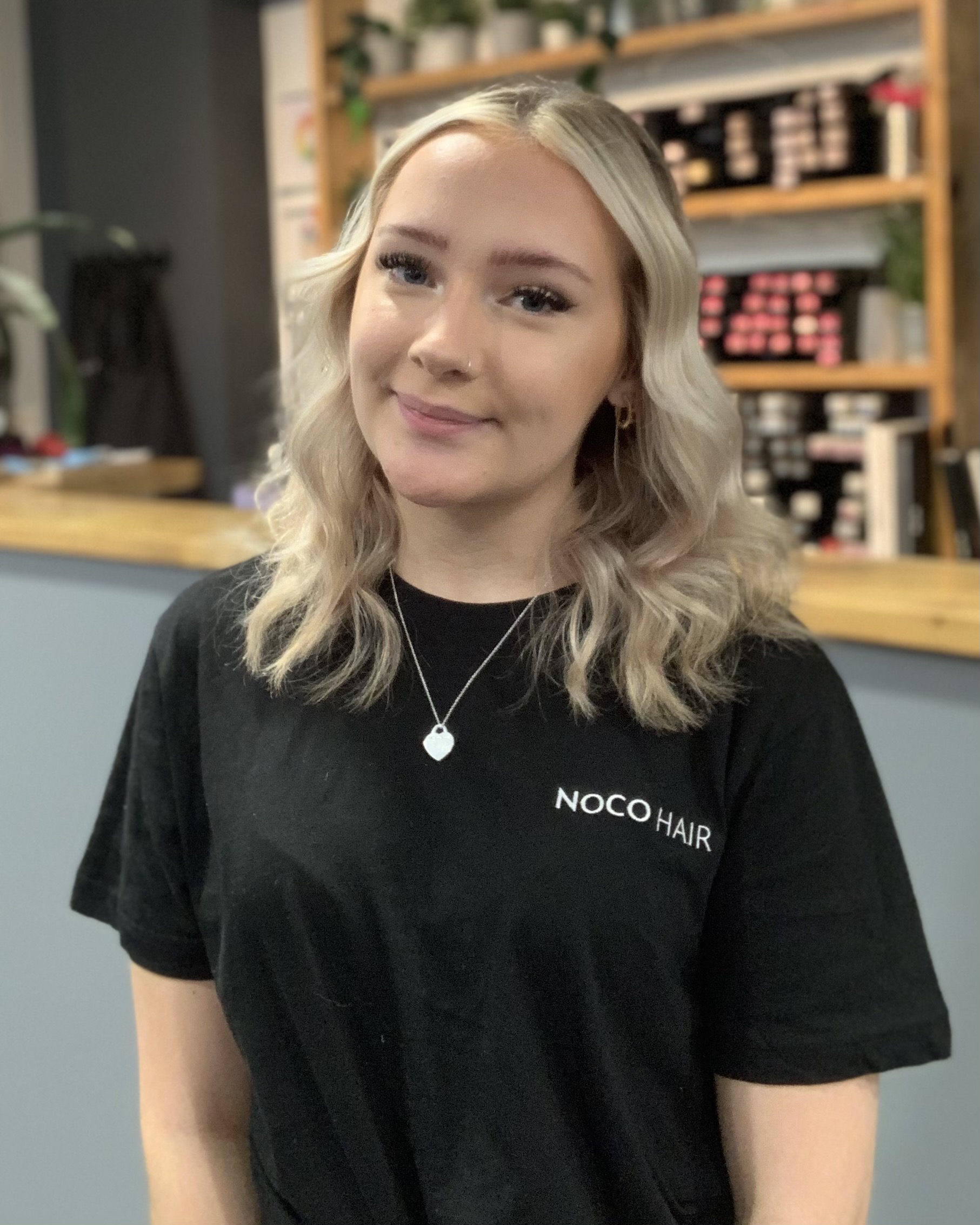 Senior stylist posing for photo