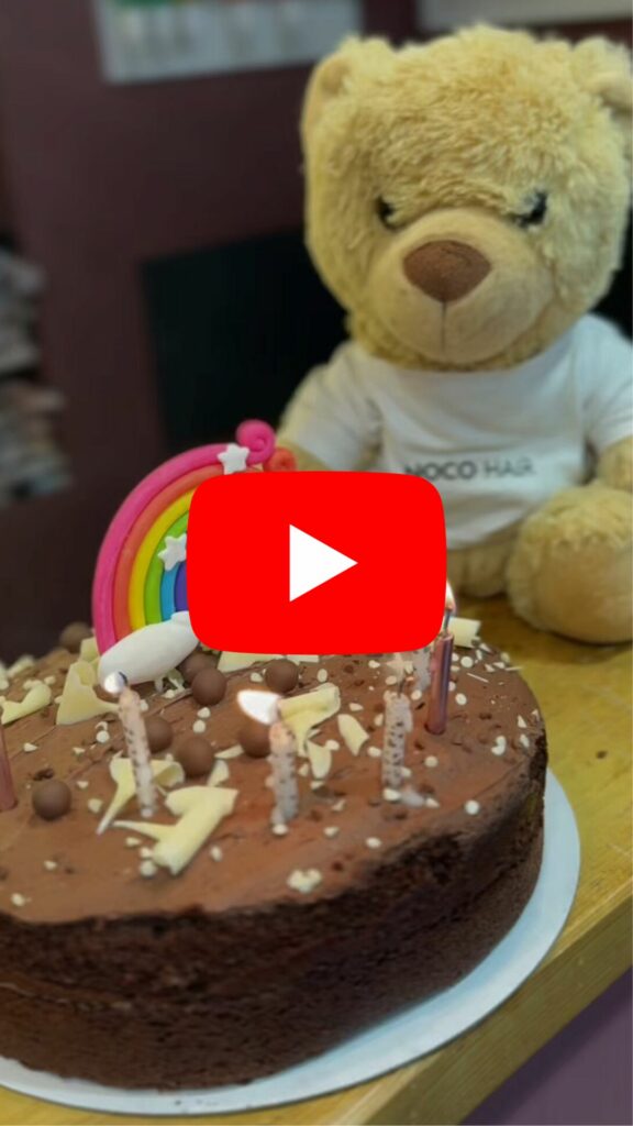 Award-winning NOCO Hair Salon celebrates seven years in business with our mascot NOCO Bear blowing out the candles! 
