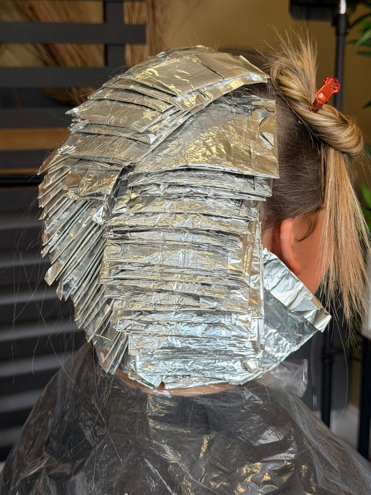 Foils being applied for copper hair transformation at NOCO Hair Bristol