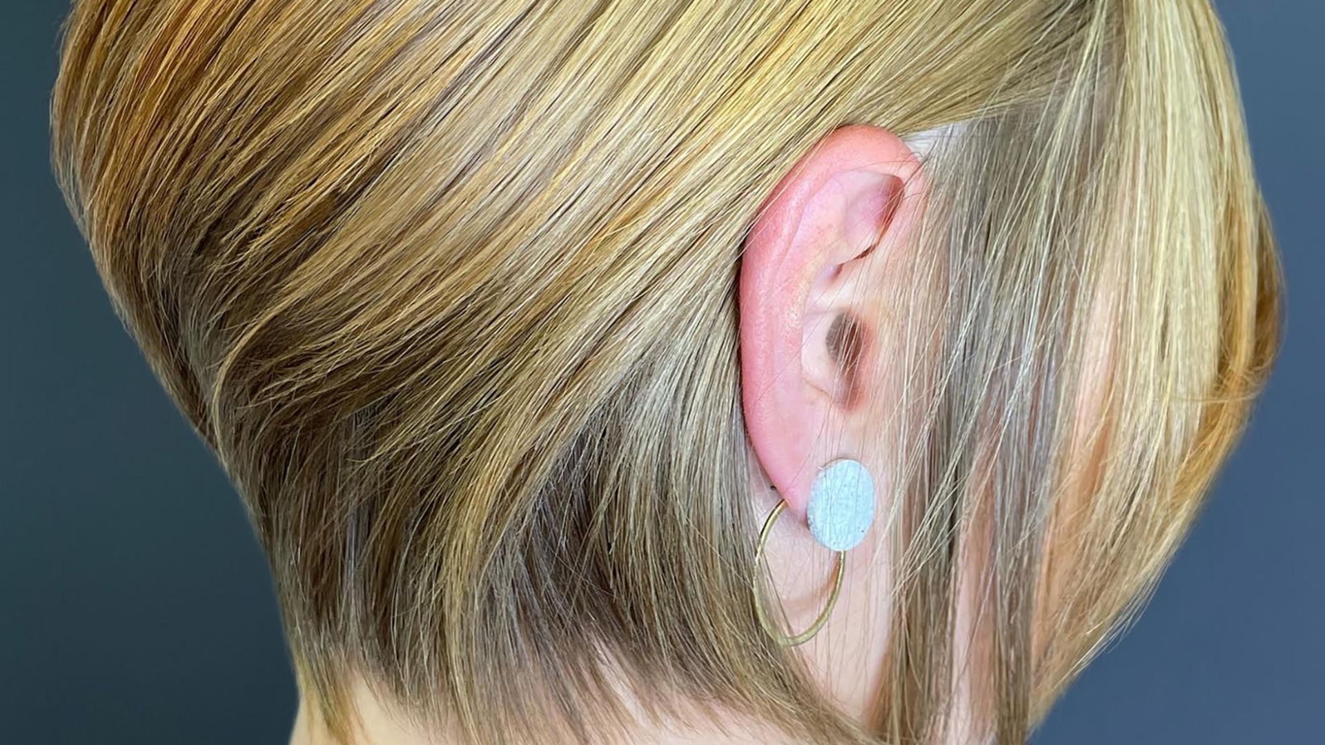 Back view of a short graduated blonde bob cut at NOCO Hair Bristol.